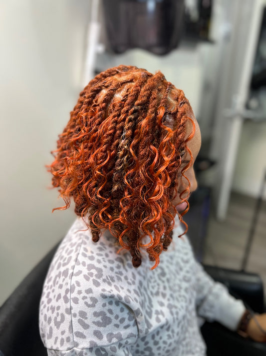 Shoulder-length micro locs with defined parting after professional retightening